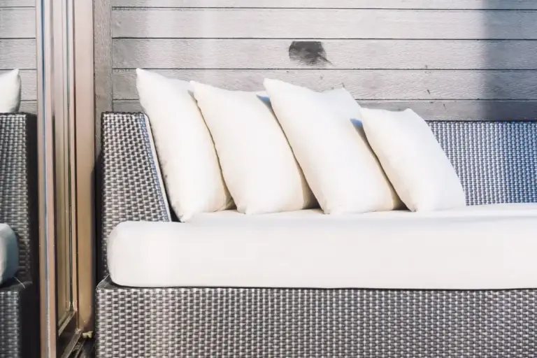 cozy outdoor patio with cushions and blankets