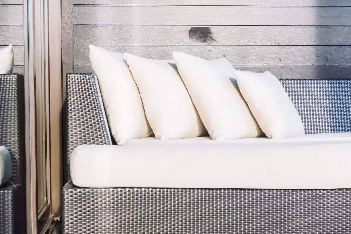 cozy outdoor patio with cushions and blankets
